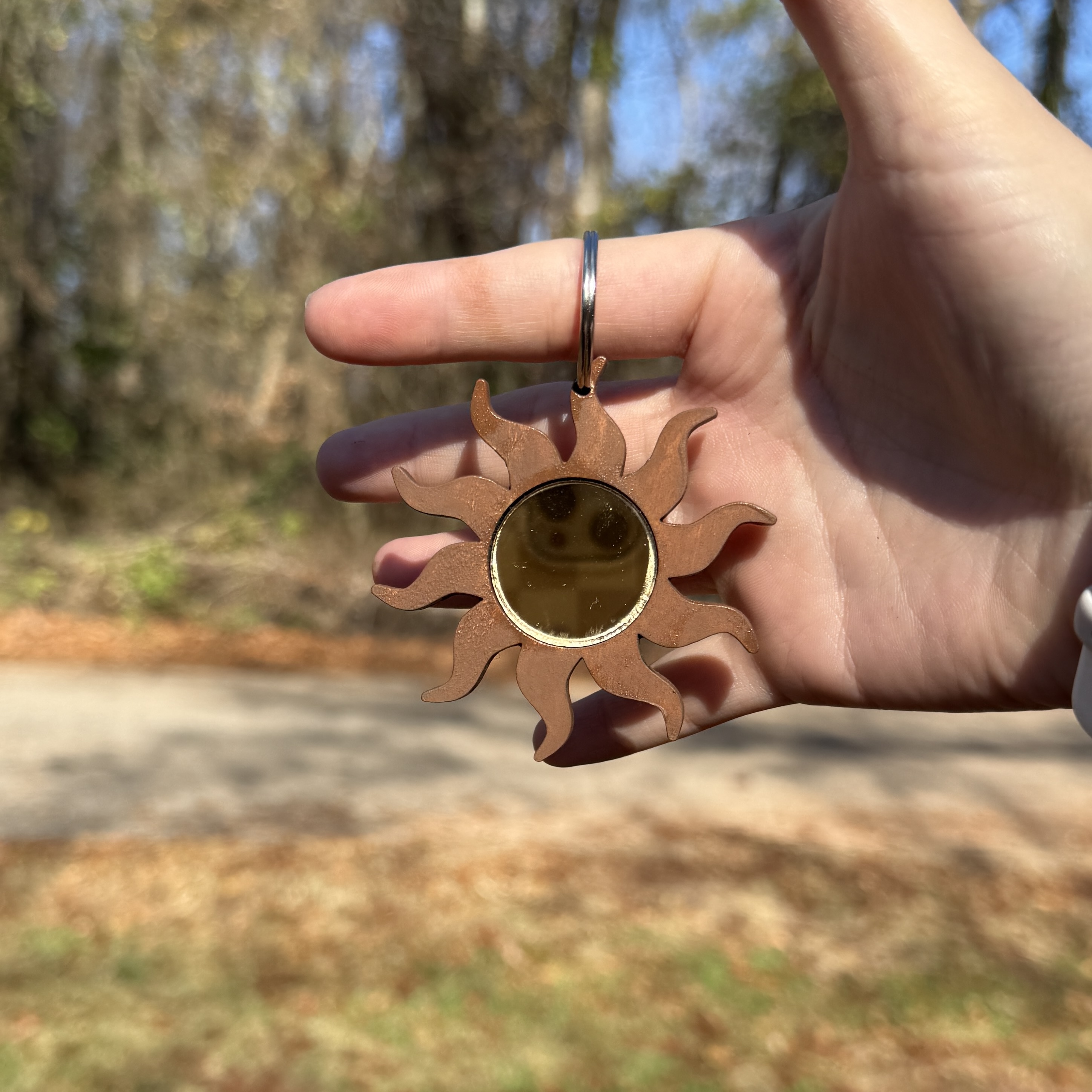 Laser cut mirror with a sunny design